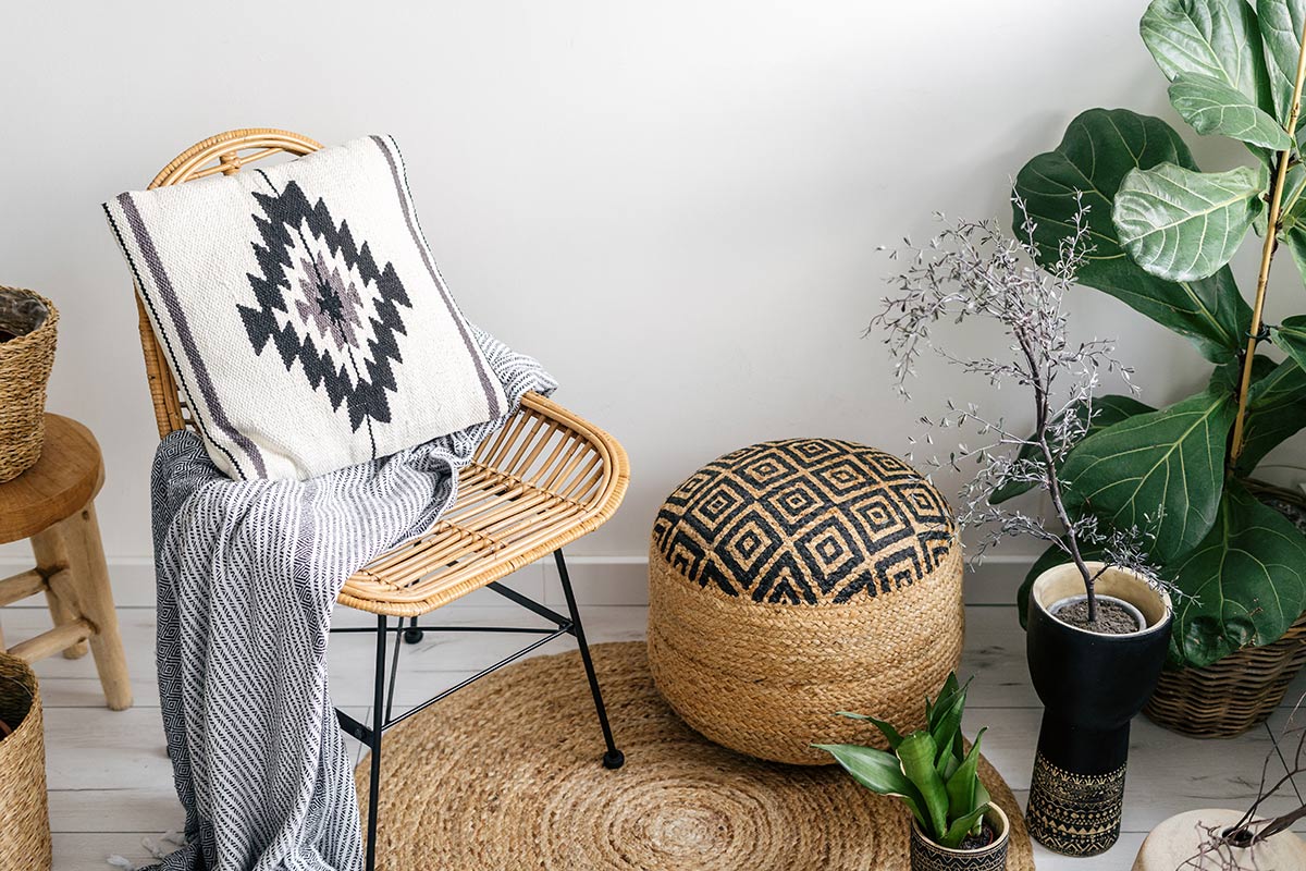 A neutral grey coloured throw on a chair.